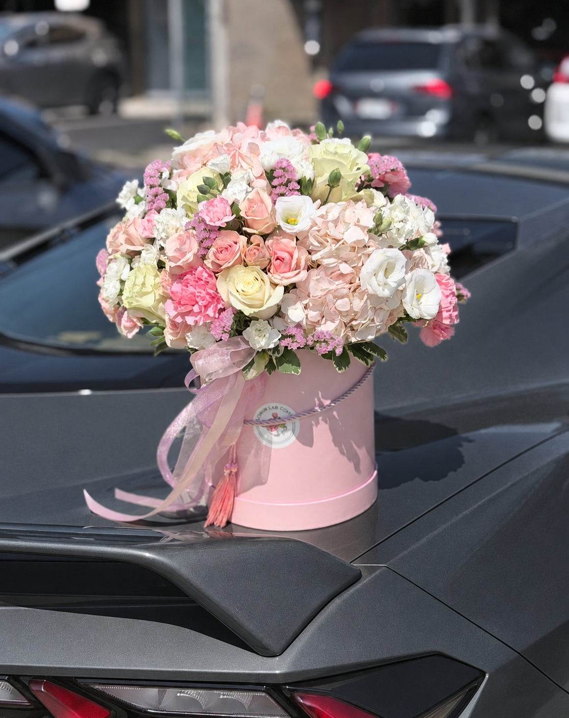 Blush Serenade Flower Box: pastel roses, hydrangeas, lisianthus and carnations in a pink hatbox.