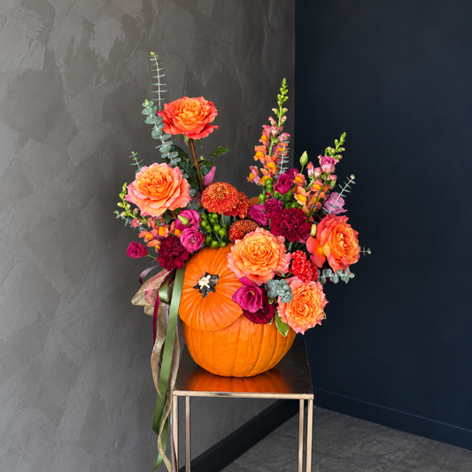 Gather & Glow orange pumpkin arrangement with autumn roses, burgundy flowers and eucalyptus — The Flower Lab