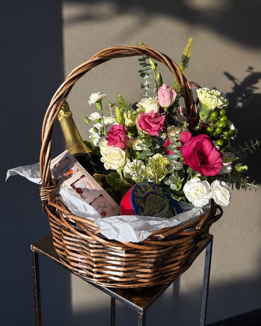 The Appreciation Basket with burgundy flowers, black caviar and jam; bottle pictured for styling inspiration only and not included.